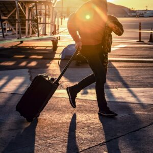 Business traveller walking with luggage